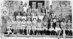 RCTS 4th and 5th graders pose in front of the 1919 building for a photo with principal E. S. Peoples in 1936