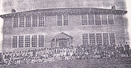 1919 RCTS school building with its principal, the student body and teachers in front